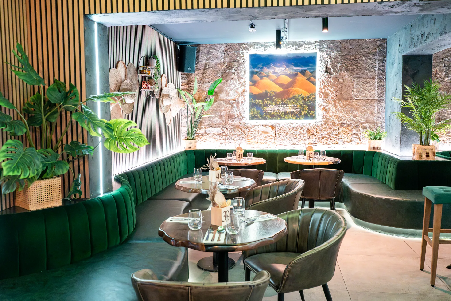 The green banquette and dining tables in Glasgow’s Visayas room